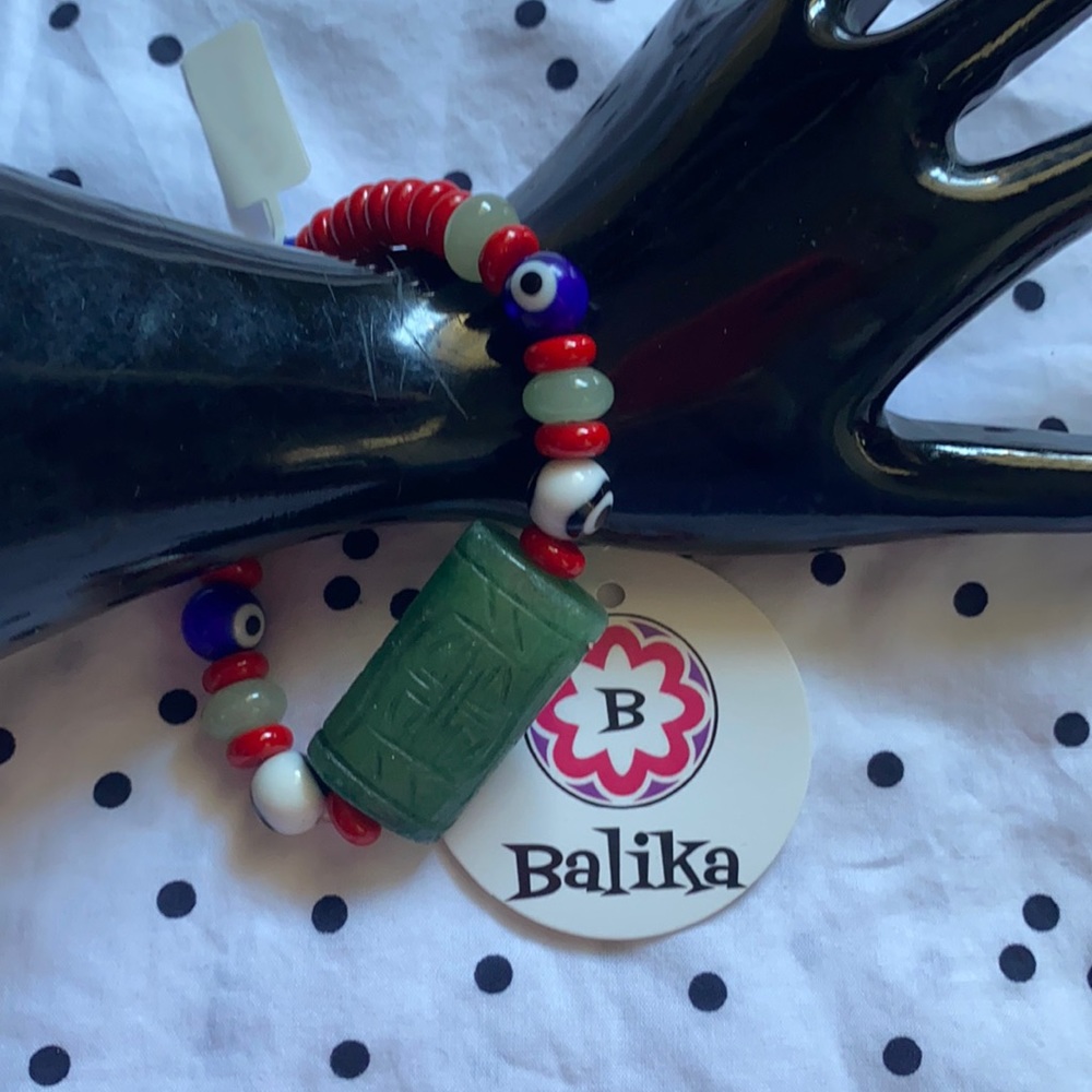 Handcrafted beaded bracelet. Green Jade, evil eye beads & red beads.